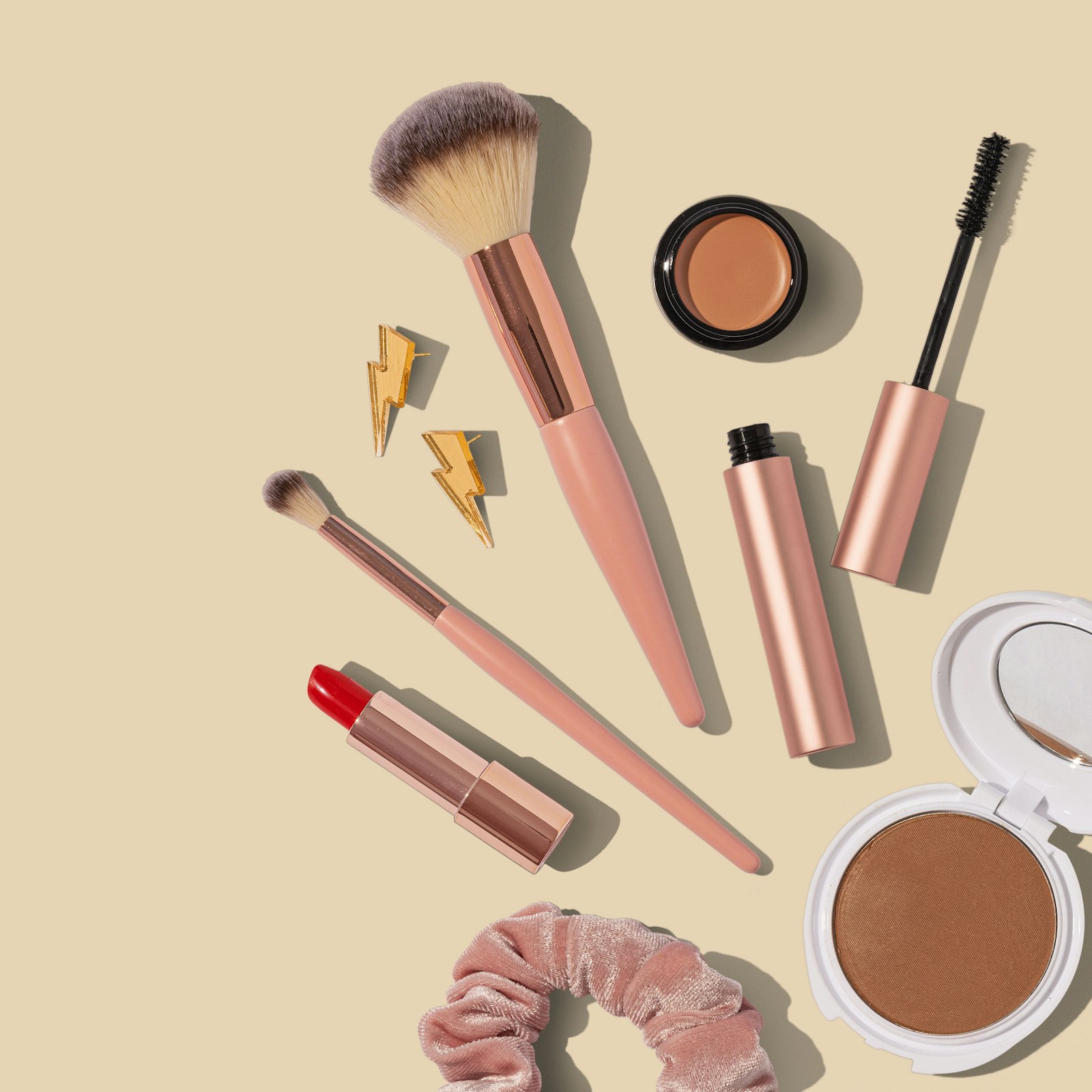 Cosmetic products and beauty tools on a clean surface
