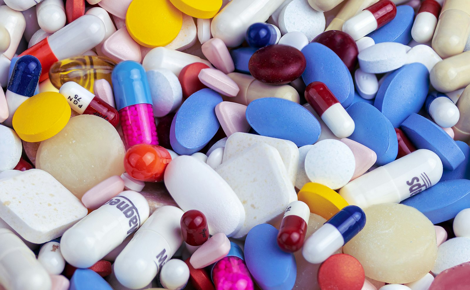 Supplement capsules and bottles on a clean surface